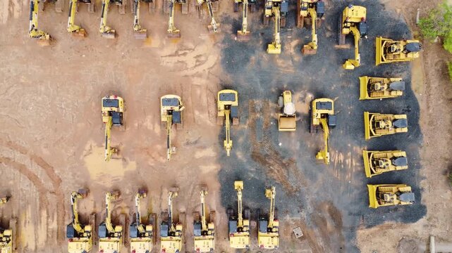 Excavator sales place or heavy equipment showroom, many excavators parked