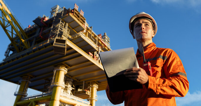 Engineer inspecting offshore oil platform structure
