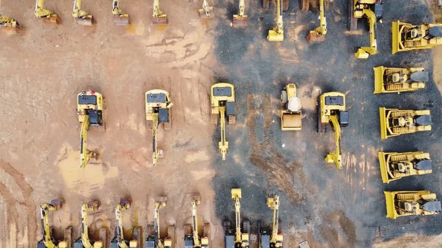 Excavator sales place or heavy equipment showroom, many excavators parked