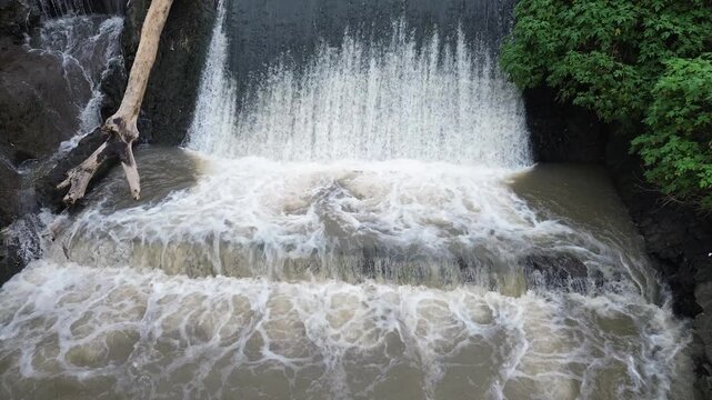 4K Aerial View of Flooded River with Muddy and Turbid Water Flow