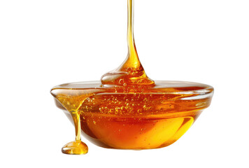 Amber liquid pours into a glass bowl, dripping