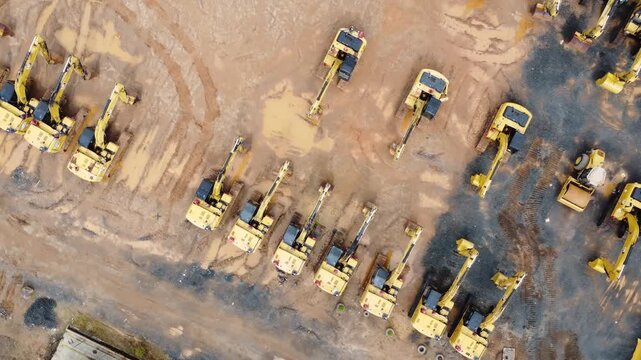 Excavator sales place or heavy equipment showroom, many excavators parked