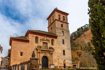 Naklejka premium Church at the foot of the cliff where the Alhambra is located in Granada, Andalusia, Spain
