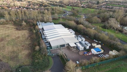 Aerial drone view of large scale cutting-edge technology and futuristic infrastructure of a large-scale data center in Milton Keynes, UK. AI cloud quantum computing. 