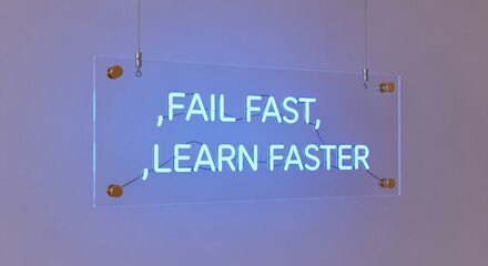 Illuminated Sign Encouraging Swift Learning from Setbacks, Emphasizing Resilience and Rapid Improvement in Business
