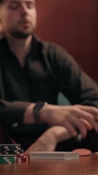 Sad frustrated Caucasian male gambler losing poker game smoking cigar at home man guy player playing cards lost blackjack defeat competition upset stressed gamer betting wager gambling addict failure