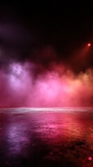 Empty studio floor glowing with colorful smoke and reflections against a black background