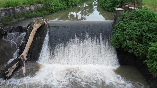 4K Aerial View of Flooded River with Muddy and Turbid Water Flow