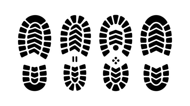 A set of four distinct black boot print silhouettes