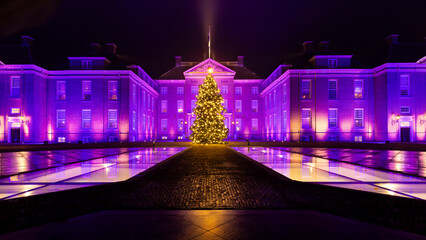Apeldoorn, The Netherlands - December 20, 2025: Scenic view of Royal Palace het Loo, National museum, illuminated in pink colors during Christmas period in Apeldoorn, The Netehrlands