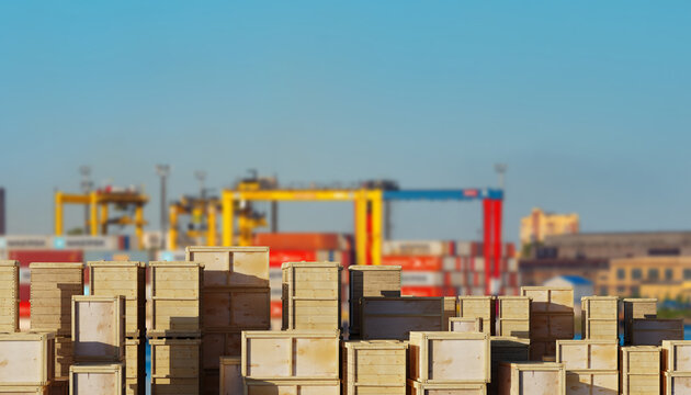 Port logistics stacks wooden cargo crates at a container terminal. Export operations, freight consolidation, maritime transport, shipping industry and global trade handling.