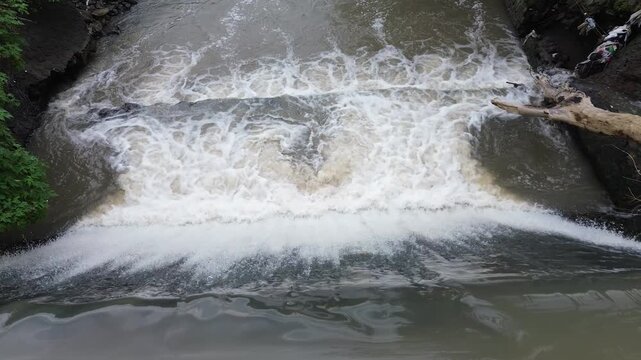 4K Aerial View of Flooded River with Muddy and Turbid Water Flow