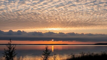 Serene Lake Sunset with Altocumulus Clouds