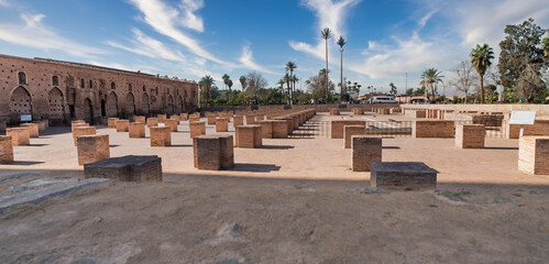 Historic Outdoor Archaeology Site With Brick Pillars, Ruins, Palm Trees, And Open Sky, Marrakesh, Morocco