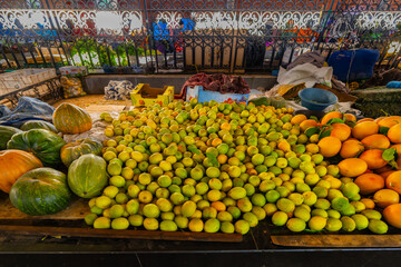 Colorful Vibrant Market Display Of Pumpkins, Lemons, And Oranges In An Outdoor Street Market Scene, Agadir, Morocco