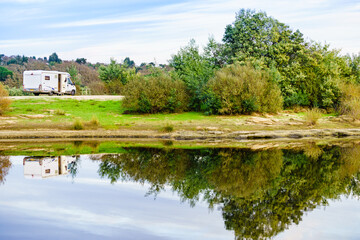 Camper rv camping at lake shore. Alentejo Portugal.