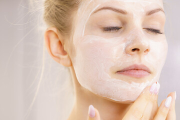 Girl apply cream cosmetic