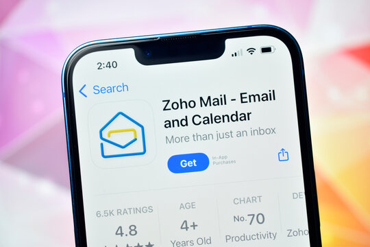 A detailed, close-up photograph showing the application page for 'Zoho Mail - Email and Calendar' displayed on the screen of a modern smartphone, likely an iPhone, ready to be downloaded.