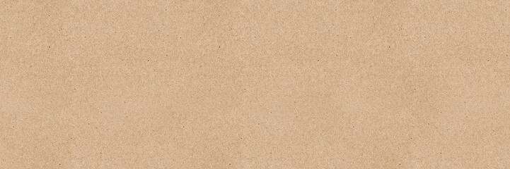 Brown kraft paper sheet - seamless background texture. Recycled cardboard carton packaging.