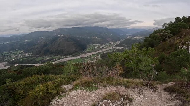 Panoramic aerial-style view over Monte Giaideit and the Tagliamento valley in Friuli Venezia Giulia, Italy, on a clear winter day.