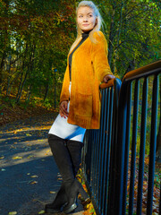 Woman walking in autumn park