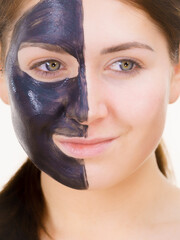 Woman with charcoal facial mask