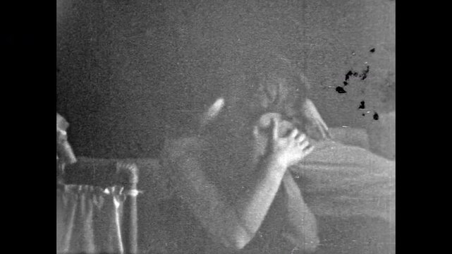 Old film, Lesbians passion kissing in bed. Adult female couple together in romantic relationship. Young women Lgbt kiss in love. Same-sex romance. Queer identity. Archival retro 1960s. Vintage archive