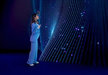 Woman reaches toward glowing 3D wave data stream surface