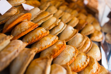 freshly baked empanadas with different fillings for sale