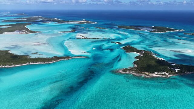 Exuma Skyline In Exuma Islands Black Point Bahamas. Turquoise Ocean Waves Gently Crashing On Tropical Beach. Shore Sky Clouds Beach Sea. Seaside Panorama. Exuma Islands Black Point.