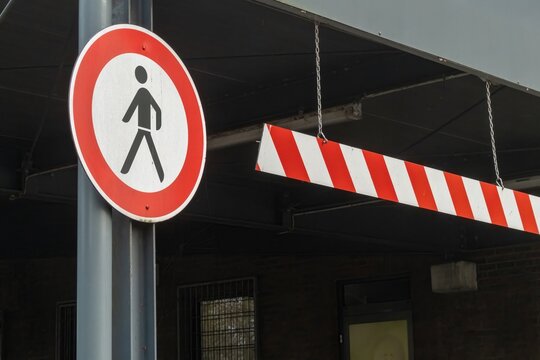 No pedestrian access sign and height restriction barrier