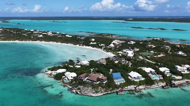 Taylor Bay Beach In Providenciales Overseas Territory Turks And Caicos Islands. City Skyline Showing Modern And Traditional Architecture. Coast Sky Clouds Seaside Summertime.