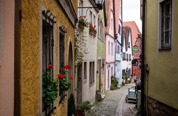 Charming medieval alley with colorful houses in Rothenburg ob der Tauber old town