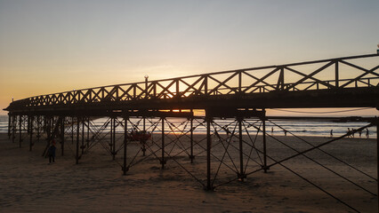 Summer sunset at the port of Pimentel, with a view of the pier in Chiclayo, Lambayeque, on the Peruvian coast