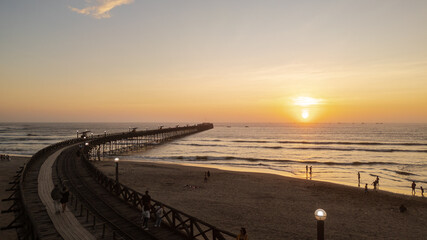 Summer sunset at the port of Pimentel, with a view of the pier in Chiclayo, Lambayeque, on the Peruvian coast