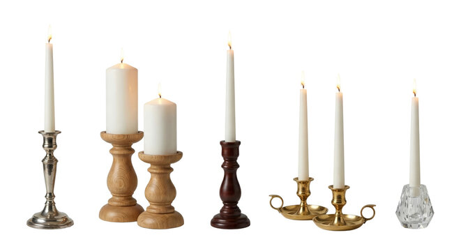 elegant collection of lit candles on ornate candle holders isolated on transparent background