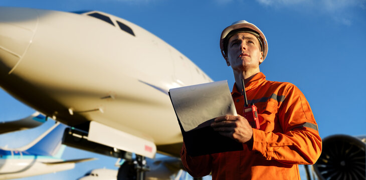 Aircraft engineer conducting pre-flight inspection