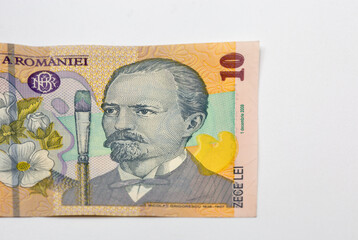 Ten leu banknotes of Romania money closeup on white.