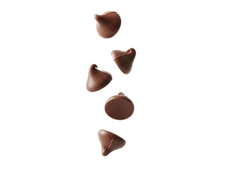 Chocolate chips falling in air with smooth surface