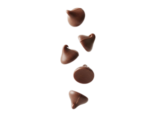 Chocolate chips falling in air with smooth surface