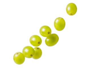 Green grapes falling in a diagonal line on white
