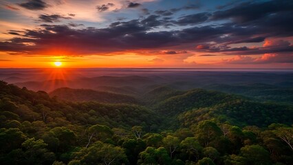 Vibrant sunset paints a majestic mountain range with golden light, casting dramatic shadows across lush green forests