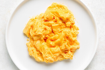 Scrambled eggs on white plate