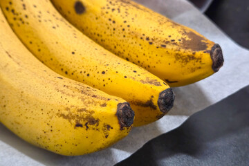 Ripe Yellow Bananas on Parchment Paper for Baking and Healthy Eating