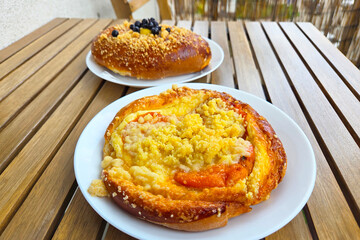 Delicious Fruit and Streusel Pastries on Wooden Table for Bakery Menu and Culinary Inspiration