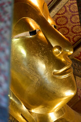 Bangkok, Thailand - 21st December 2025: Close up of face of Reclining Buddah Temple of the Reclining Buddha