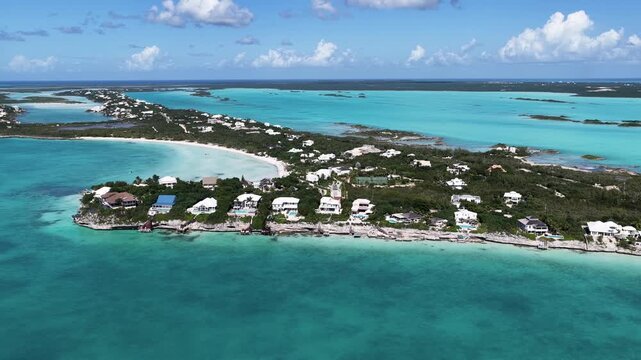 Taylor Bay Beach In Providenciales Overseas Territory Turks And Caicos Islands. Modern City Center With Skyscrapers Reflecting The Urban Life. Coast Clouds Sky Seaside Summertime.
