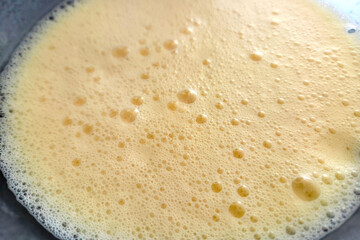 Close-Up of Frothy Whisked Eggs for Cooking and Baking Preparation