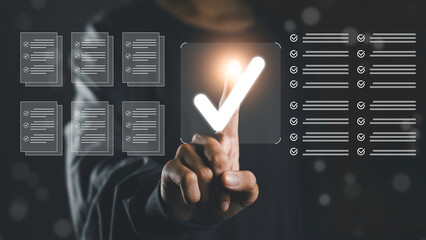 Finger pressing a digital check mark symbol on a virtual checklist, representing audit, compliance, data security, quality control, and systematic document verification in business environments.