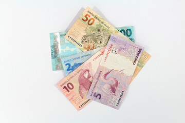 several Brazilian Real banknotes